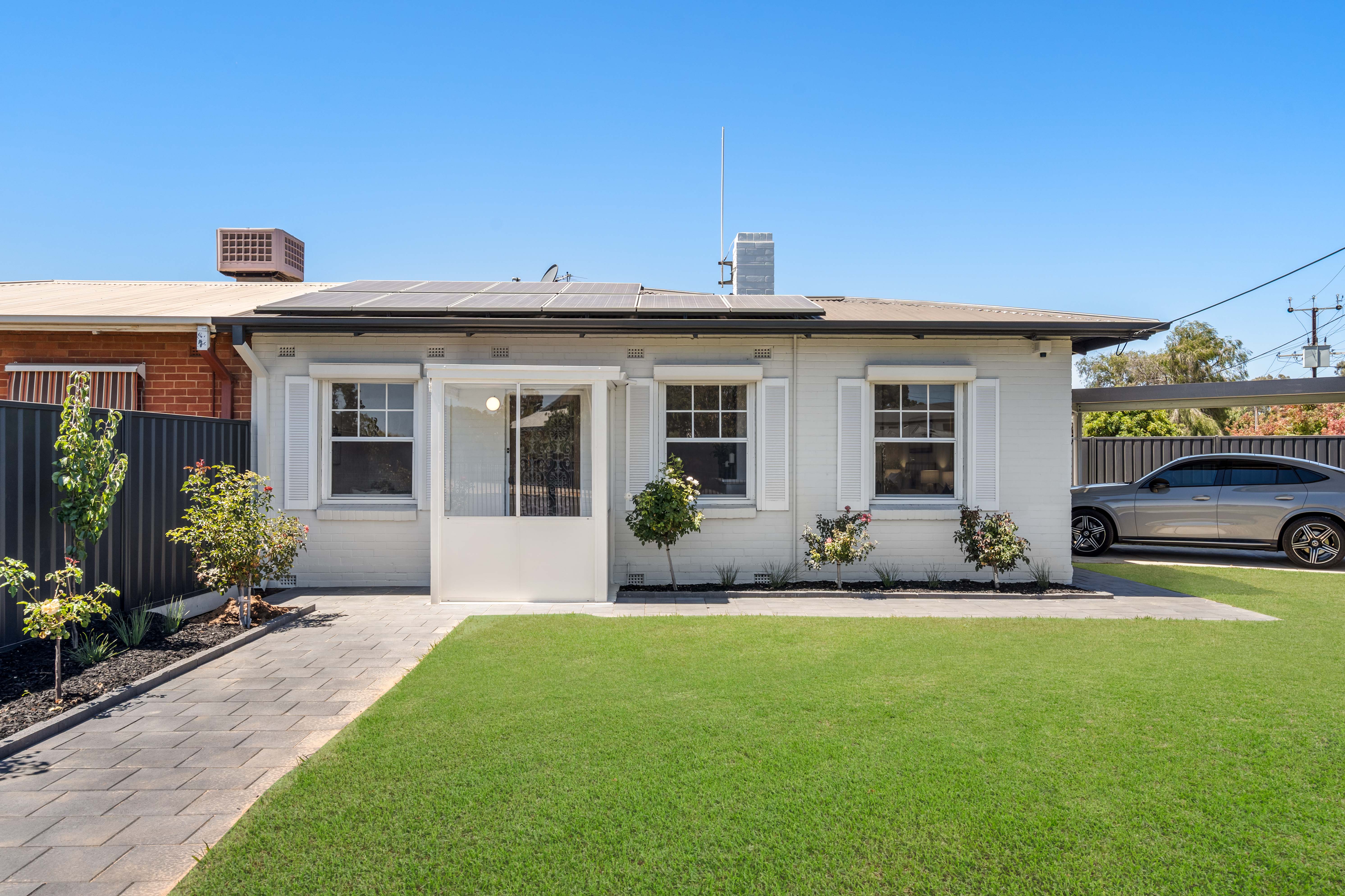 Front facade with landscaped lawn